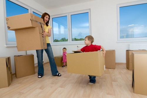 Two movers handling furniture carefully during a removal job