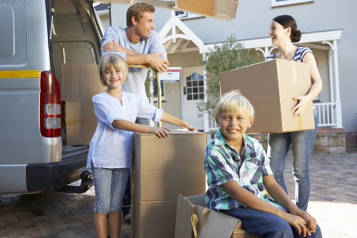 A safety-focused moving team checking access and lift routes